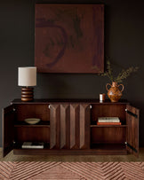 Dark mango wood sideboard with open cabinet doors, vertical slat detailing, and interior shelving displayed in a styled room setting.