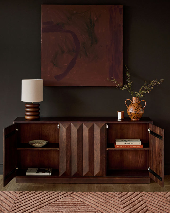 Dark mango wood sideboard with open cabinet doors, vertical slat detailing, and interior shelving displayed in a styled room setting.