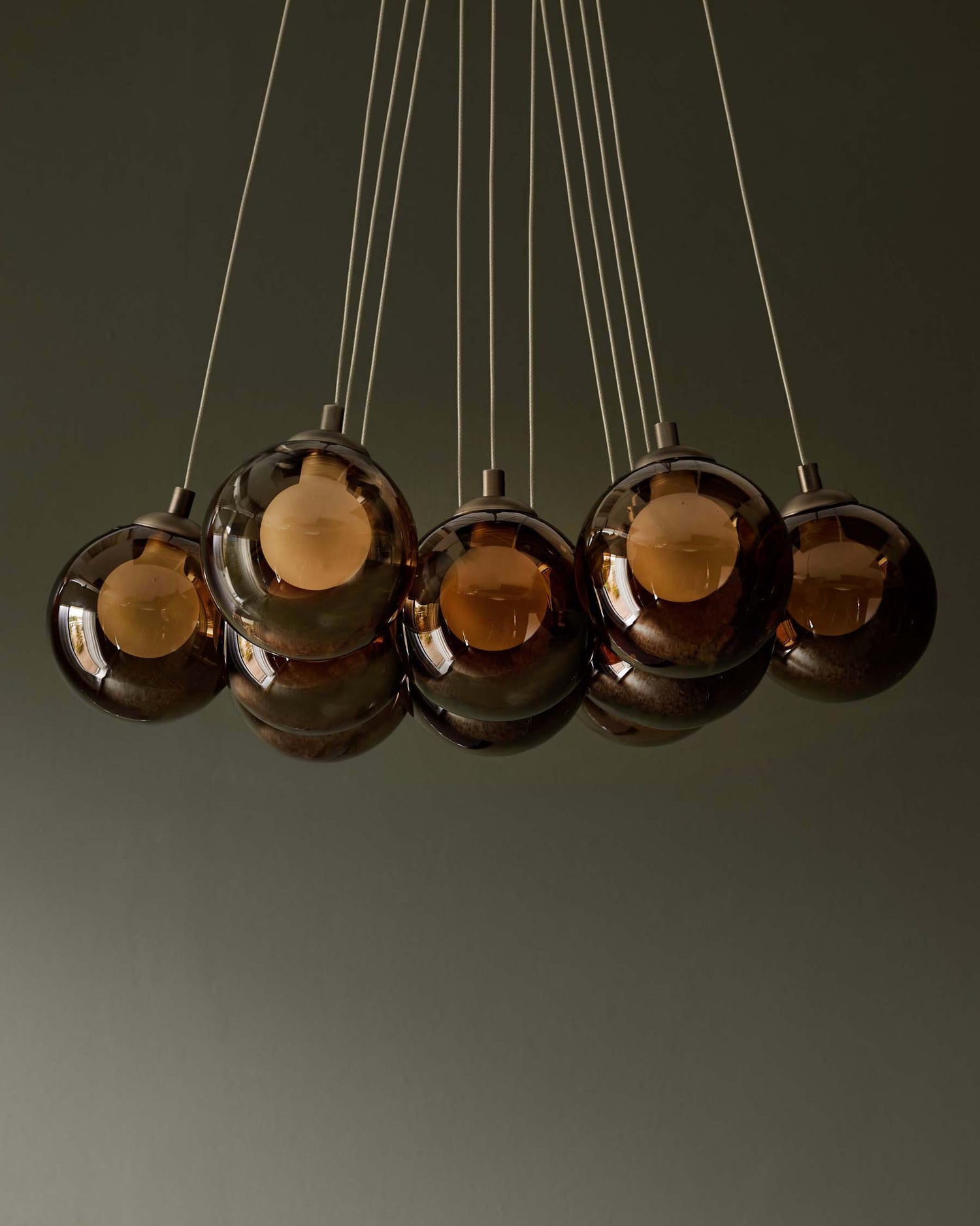 Cluster of glass pendant lights. Contemporary lighting arrangement perfect for adding subtle style to the modern home.