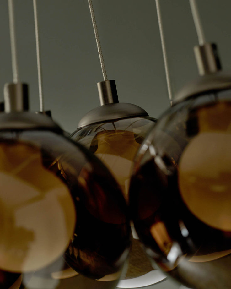 Stylish hanging lights with glass globes. A sophisticated addition to any room.
