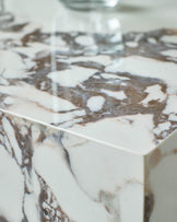 Close-up of a stylish marble countertop. Features brown and white veining for a luxurious touch in any kitchen or bathroom.