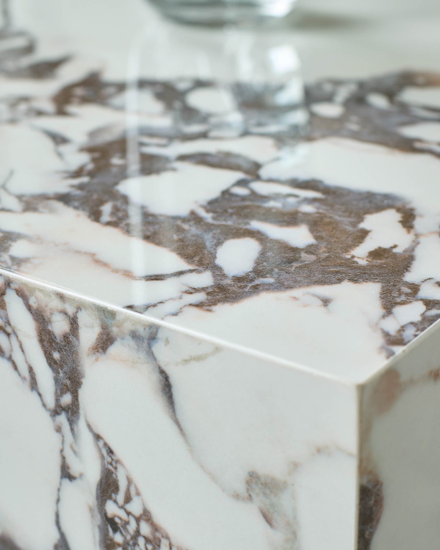 Close-up of a stylish marble countertop. Features brown and white veining for a luxurious touch in any kitchen or bathroom.