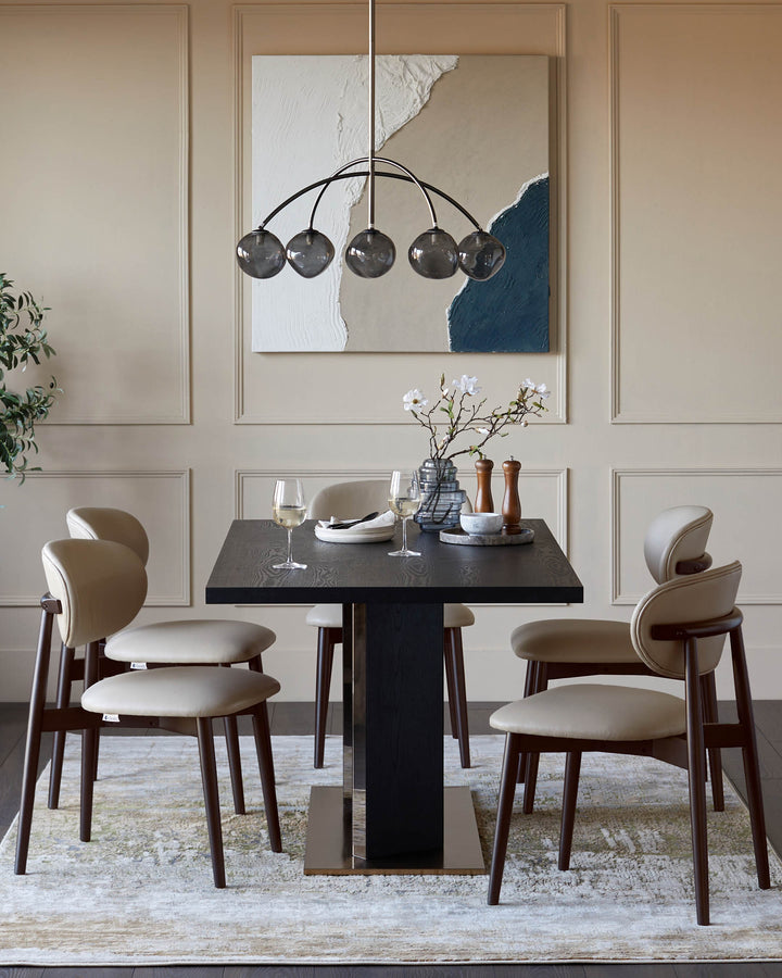 A dining set featuring a dark wood table and beige leather chairs under a stylish multi-bulb pendant light.