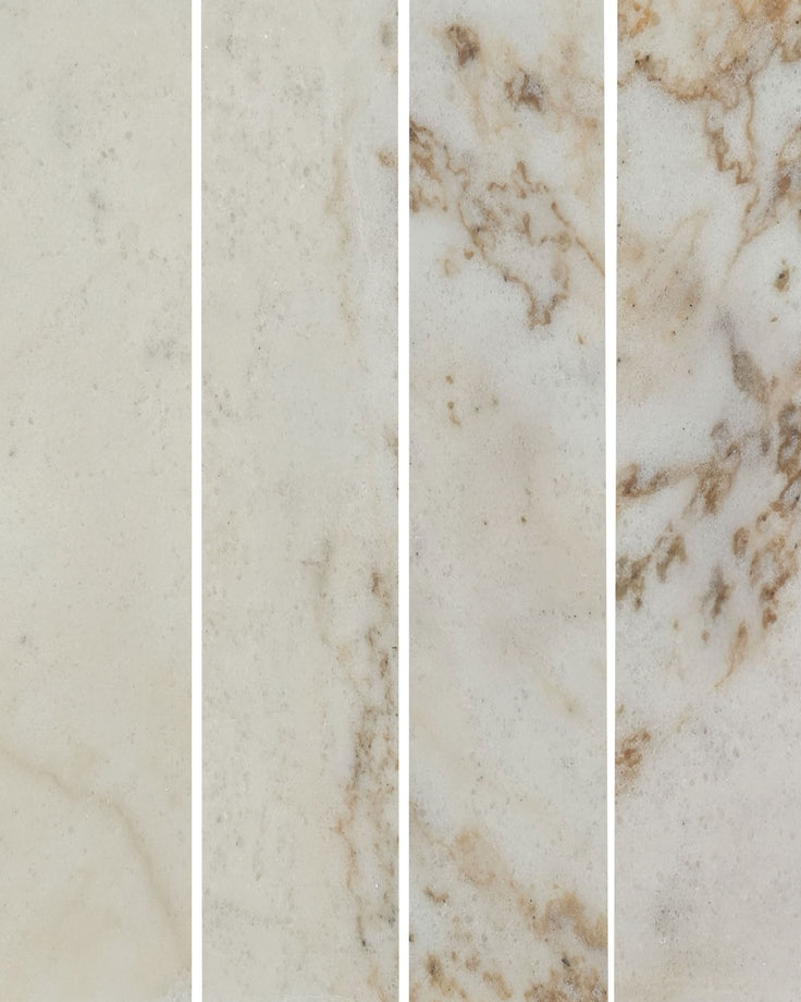 Four vertical marble tile samples showing cream and beige tones with natural veining and subtle brown accents.