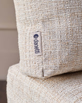 Cream woven fabric corner bench with Openiti brand label visible on side seam detail.