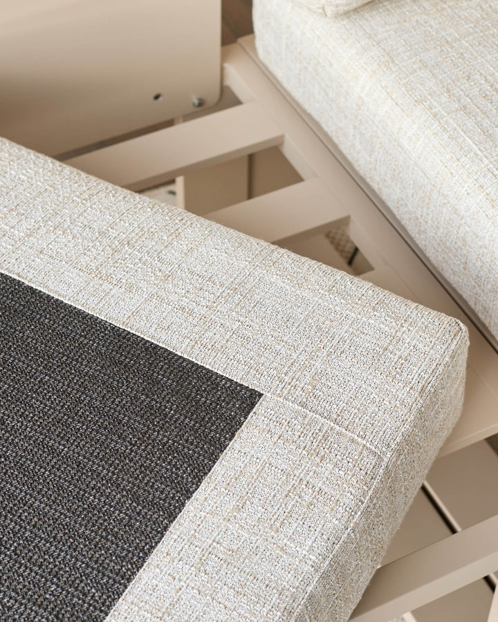 Savannah Garden large corner bench in natural, showing close-up of cream upholstery with black cushion detail and wooden base.
