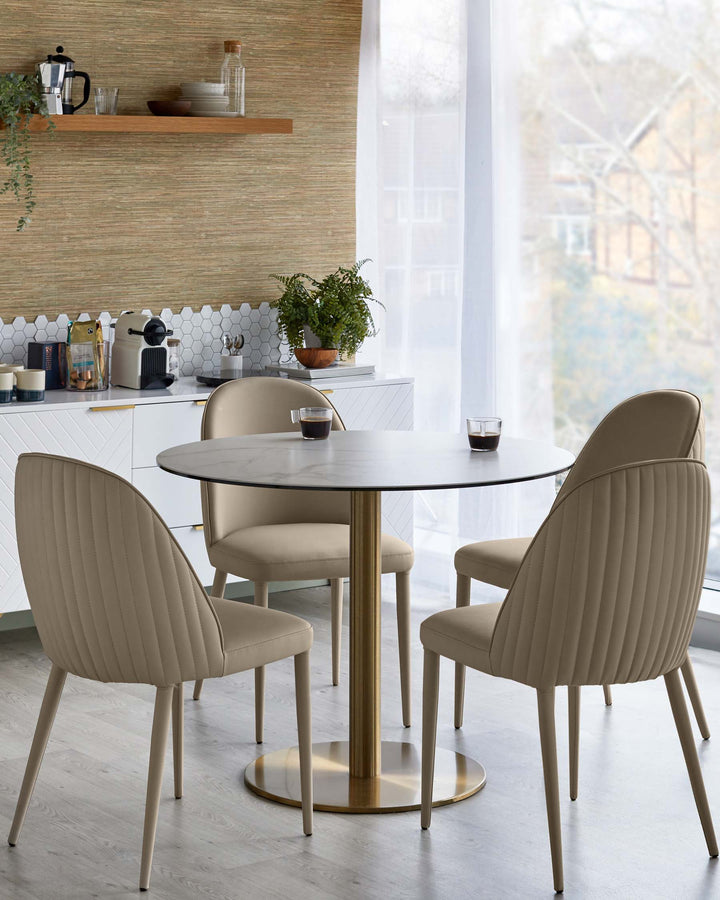 A dining table with a marble top and gold base, surrounded by four upholstered chairs with vertical stitching.