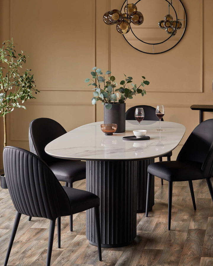 A modern dining set with black chairs and a marble-look table, perfect for stylish homes.