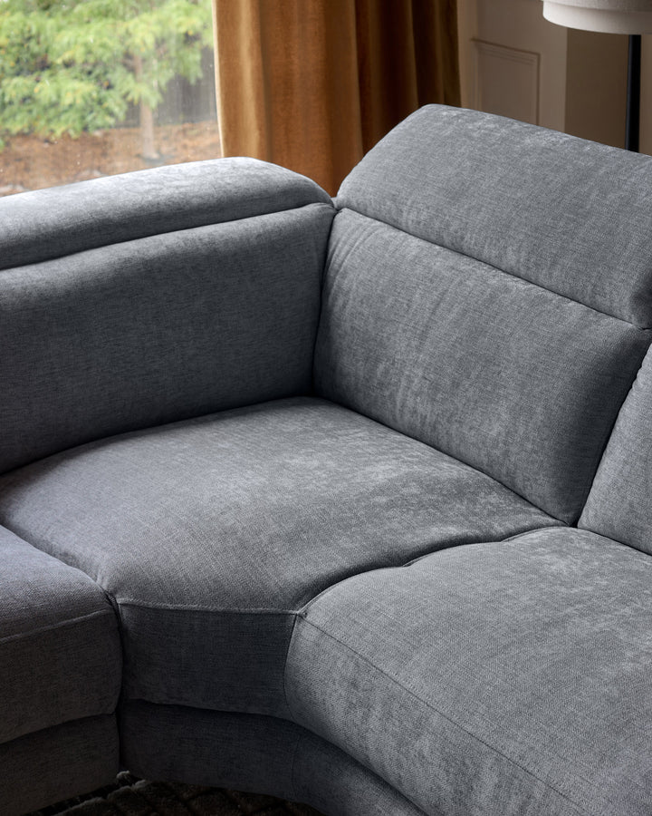 Grey chenille left chaise recliner sofa with plush cushioning, shown at a close-up angle highlighting the seat and armrest details.