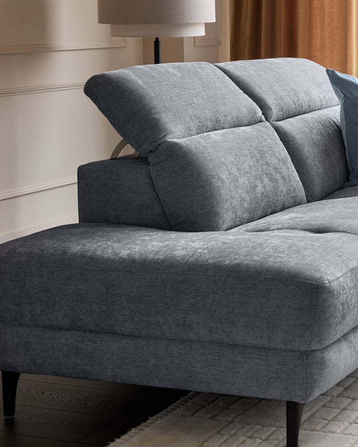Serene left chaise recliner sofa in blue-grey chenille with adjustable backrest pillows and dark wooden legs.
