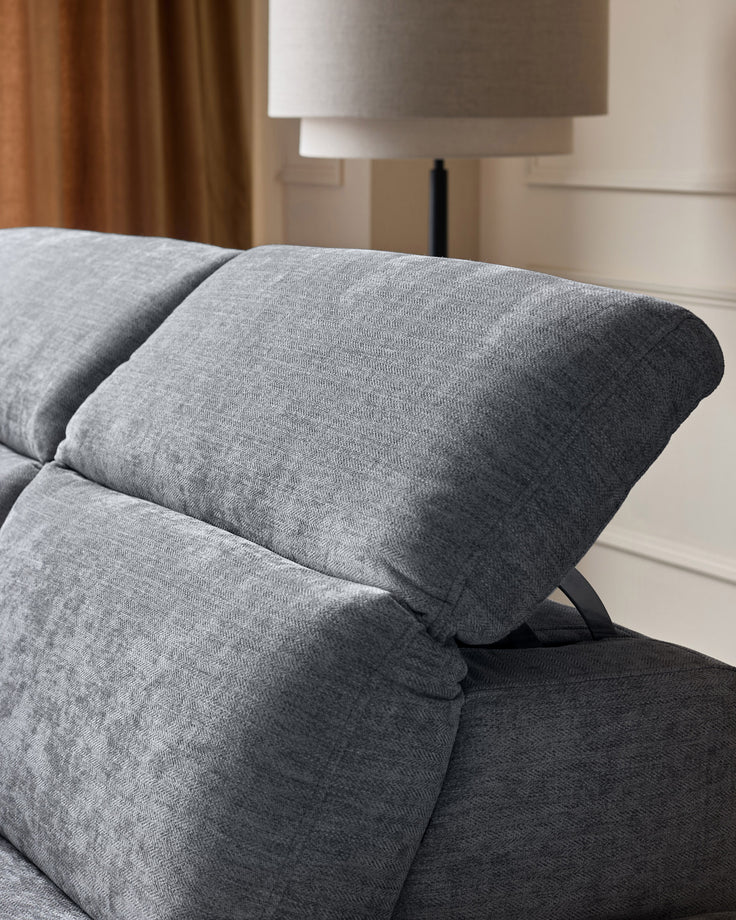 Grey chenille left chaise recliner sofa with angled armrest and black metal feet detail.