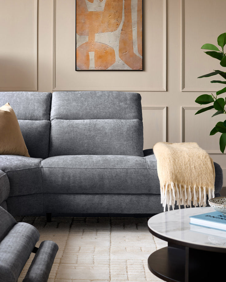 Serene right chaise recliner sofa in blue-grey chenille, shown in a styled living room setting with cream throw blanket.