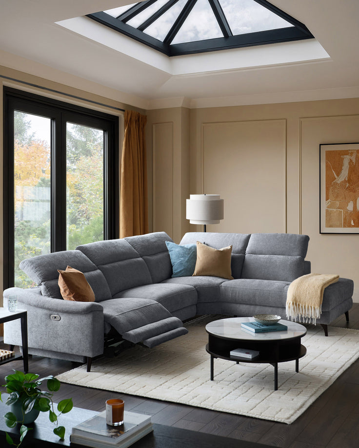 Grey chenille right chaise recliner sofa with extended footrest, displayed in modern living room setting.
