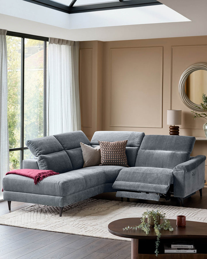 Serene left small corner recliner sofa in blue-grey fabric with extended footrest, displayed in a modern living room setting.