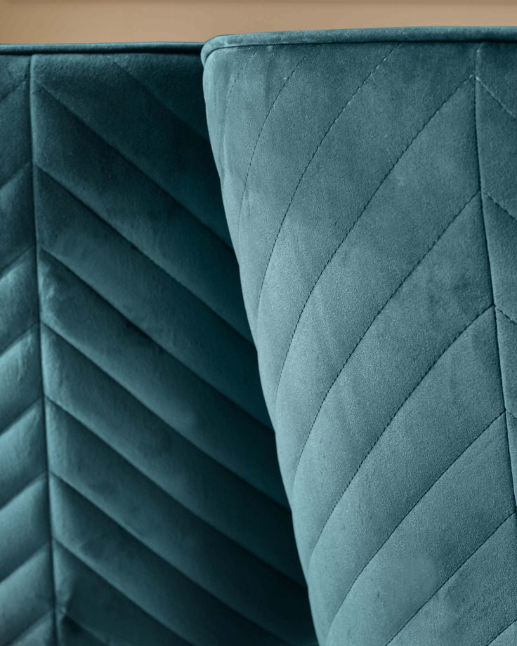 Close-up of stylish teal velvet headboard with geometric stitching. Modern and luxurious bedroom furniture design.