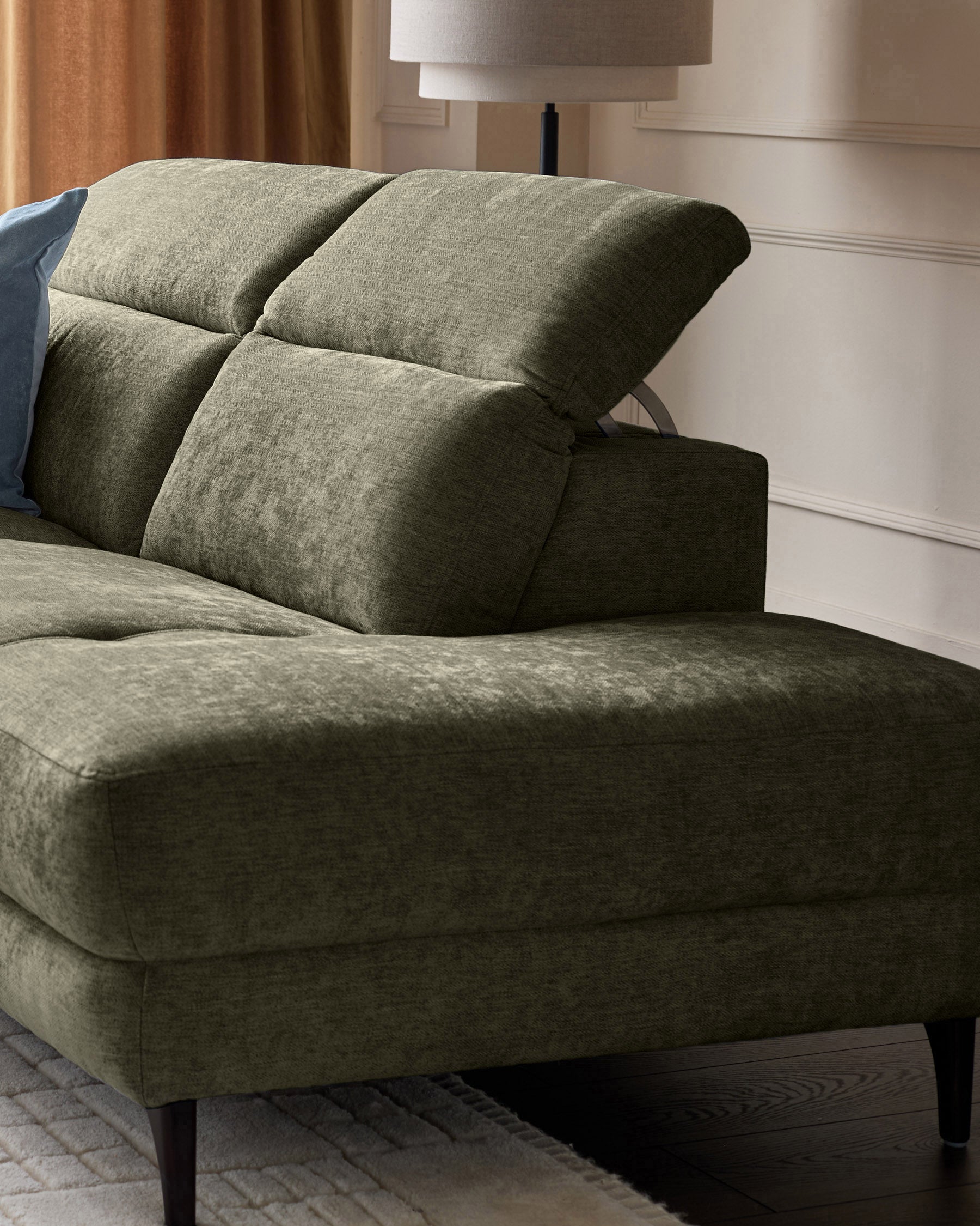 Serene right chaise recliner sofa in dark green chenille fabric, showing reclined position with pillow backs and dark wooden legs.