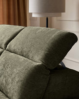 Serene left chaise recliner sofa in dark green chenille, close-up of rolled arm and cushioned seat detail.