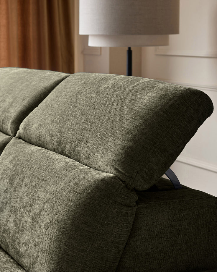 Serene left chaise recliner sofa in dark green chenille, close-up of rolled arm and cushioned seat detail.