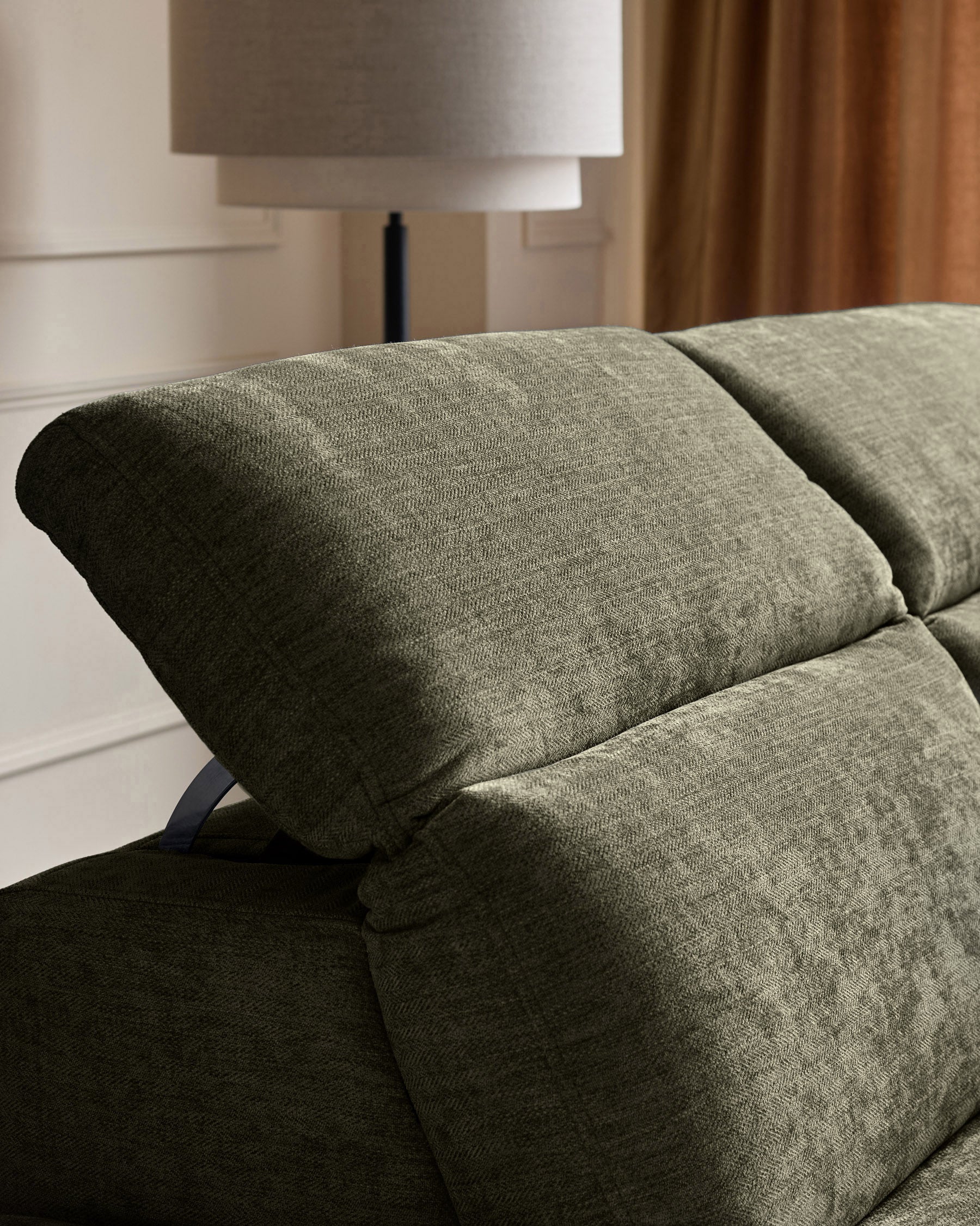 Serene right chaise recliner in dark green chenille, close-up of rolled armrest and cushioned seat detail.