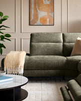 Serene left chaise recliner sofa in dark green chenille, shown in a modern living room setting with pillows and throw blanket.