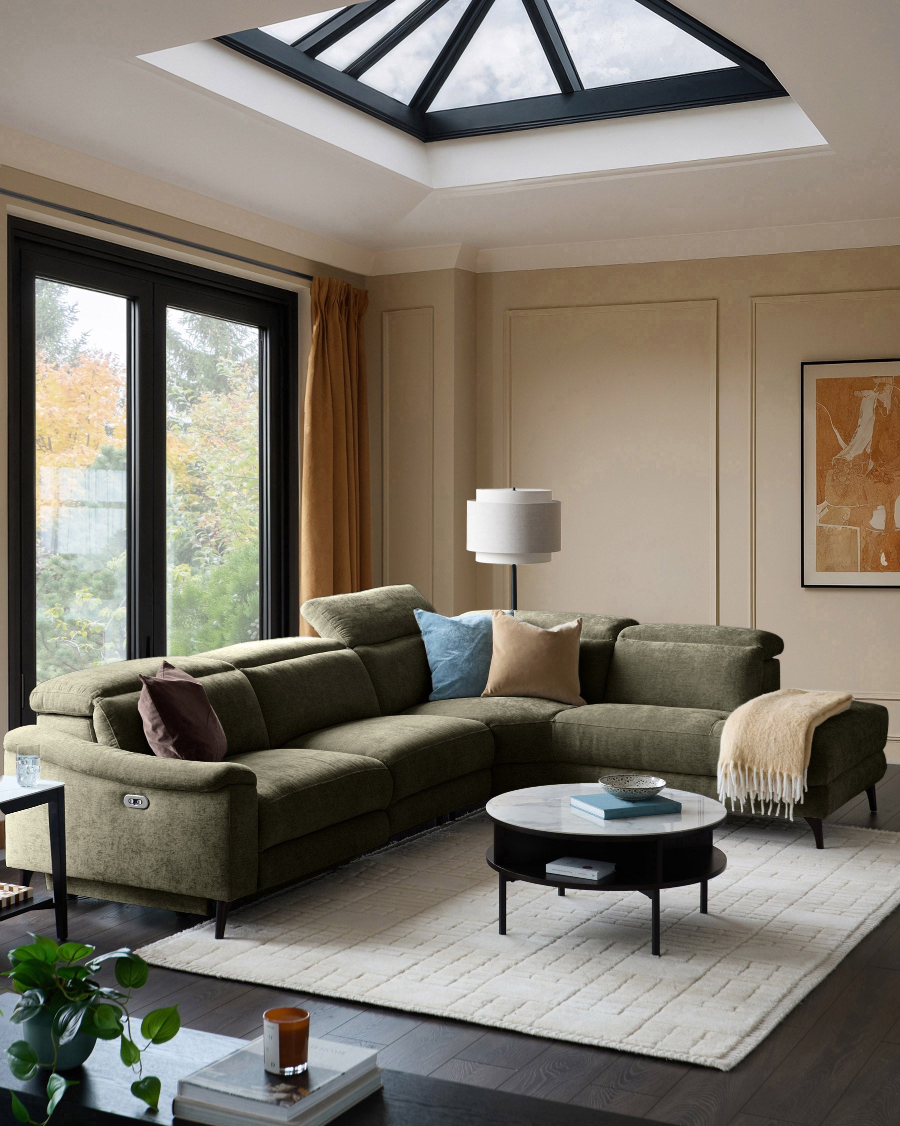 Serene right chaise recliner sofa in dark green chenille, displayed in a modern living room with reclined position visible.