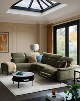 Serene left chaise recliner sofa in dark green chenille, displayed in a modern living room with extended footrest visible.