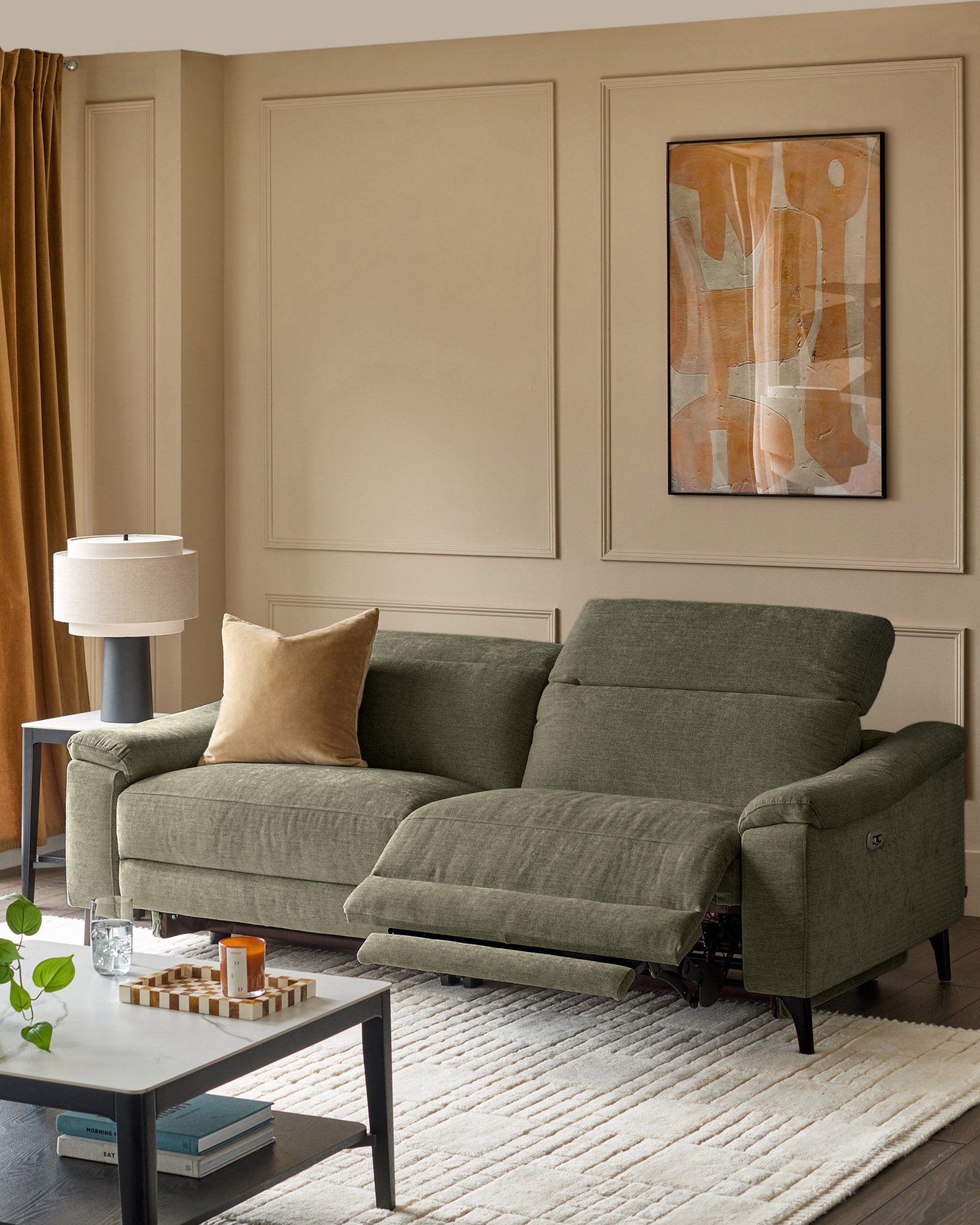 Dark green 3-seater fabric recliner sofa with extended footrests, shown in a contemporary living room setting.