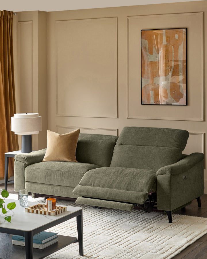 Dark green 3-seater fabric recliner sofa with extended footrests, shown in a contemporary living room setting.