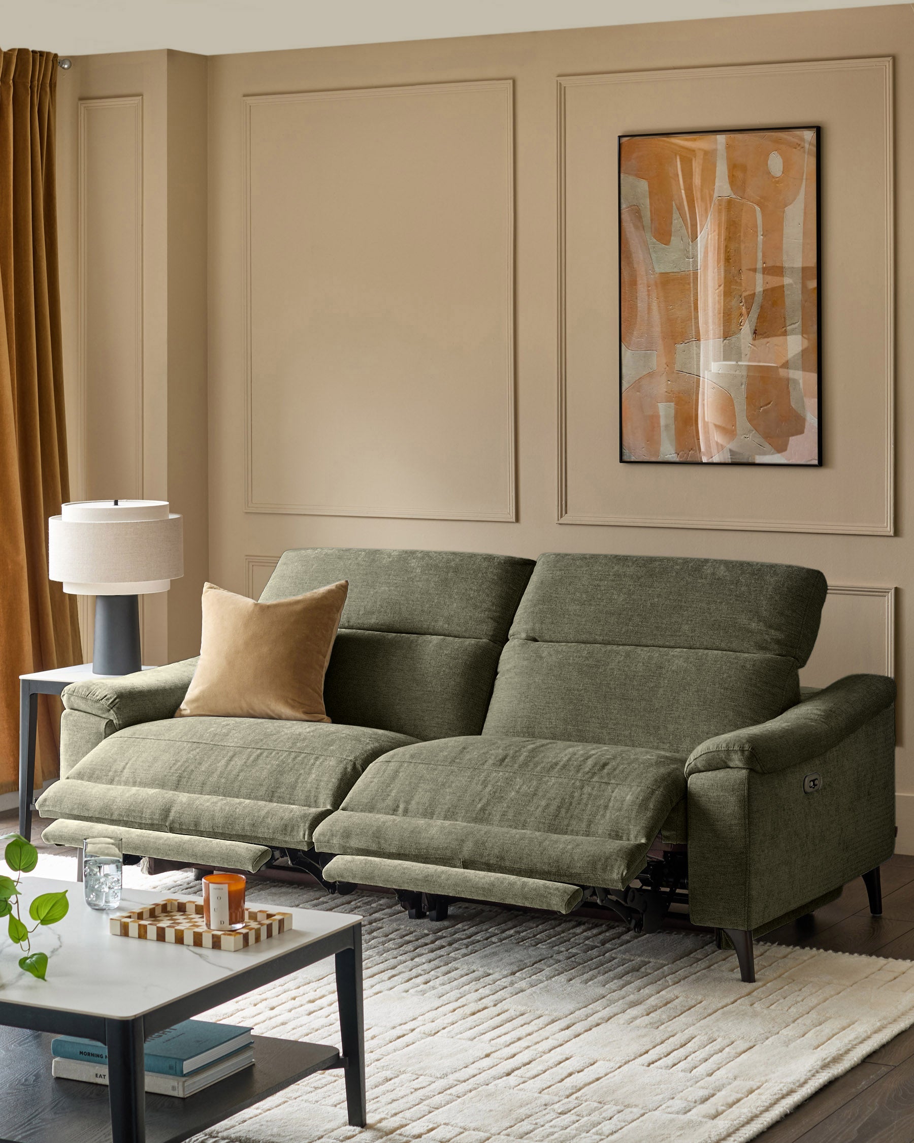 Serene 3-seater dark green fabric recliner sofa with extended footrests, displayed in a neutral living room setting.