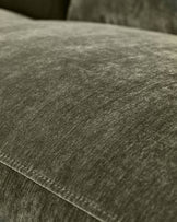 Close-up of dark green fabric texture on Serene 3-seater recliner sofa, showing weave detail and stitching.