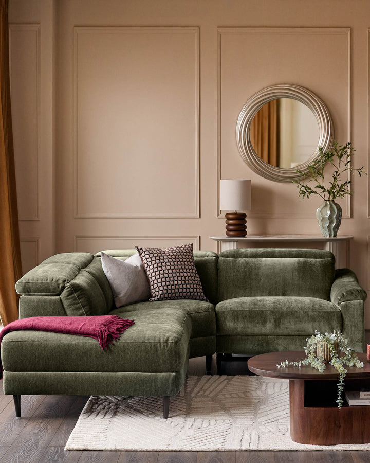 Serene left small corner recliner sofa in dark green fabric, displayed in a modern living room setting with neutral walls and wooden accents.