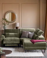 Serene right small corner recliner sofa in dark green fabric, displayed in a styled living room setting with decorative pillows and throws.