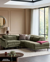 Serene right small corner recliner sofa in dark green fabric, positioned in a modern living room with skylight and large windows.