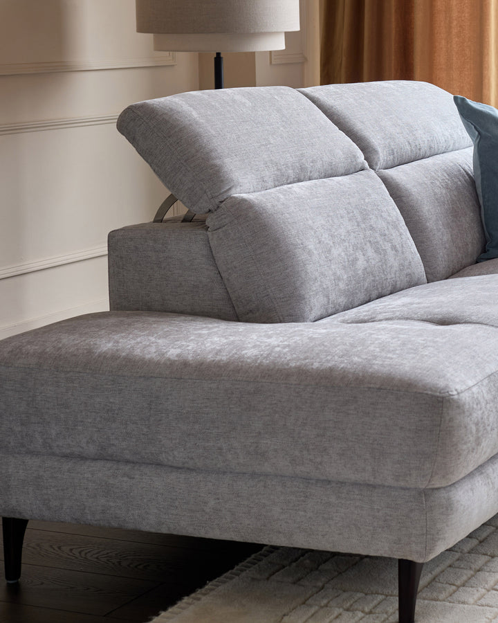 Serene left chaise recliner sofa in light grey chenille with plush cushioned backrest and armrest, wooden legs.
