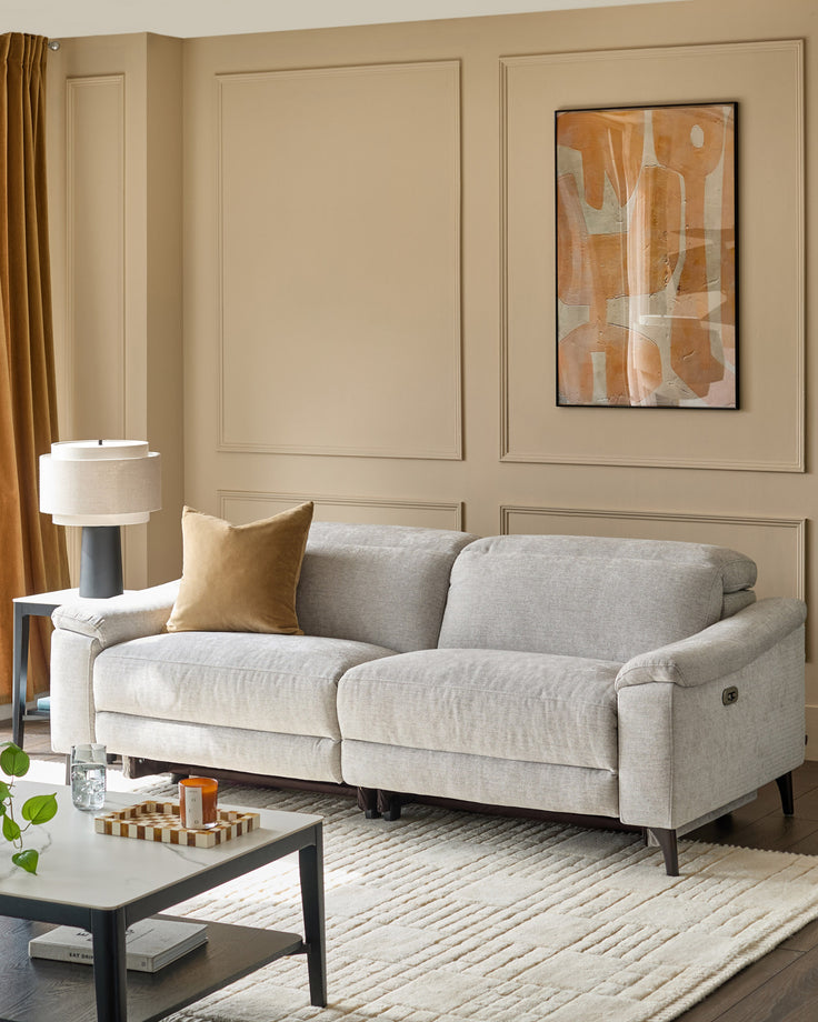 Serene 3-seater light grey fabric recliner sofa with rolled arms and tapered legs in a contemporary living room setting.
