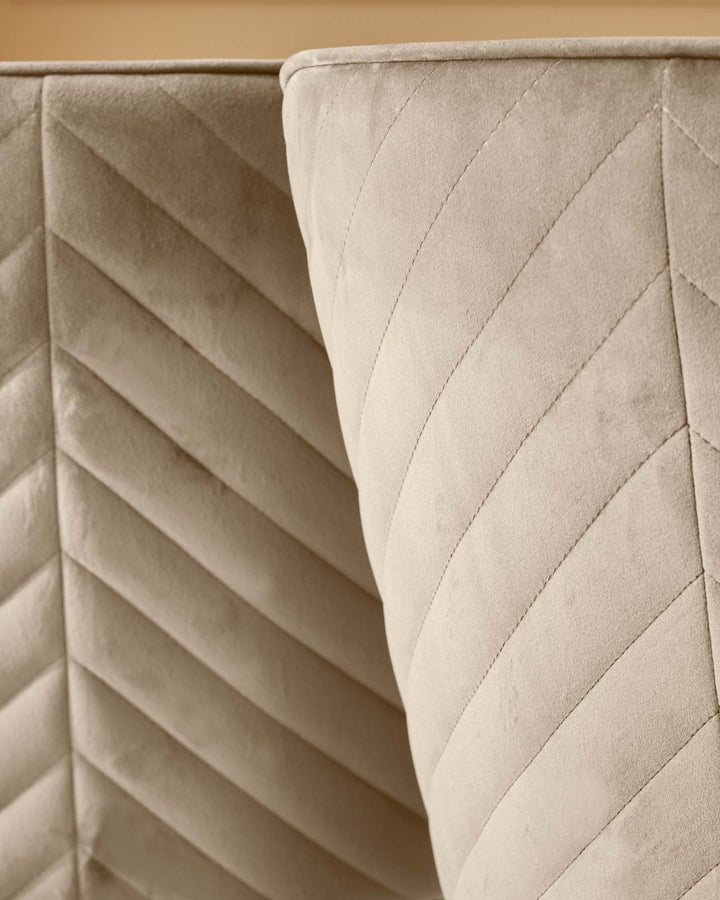Beige, quilted headboard with a soft, textured surface for a comfortable and stylish bedroom design.