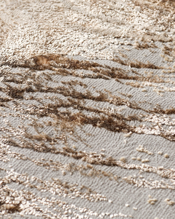 Close-up of a textured carpet featuring a blend of neutral tones and raised, patterned detailing. Ideal for adding warmth.