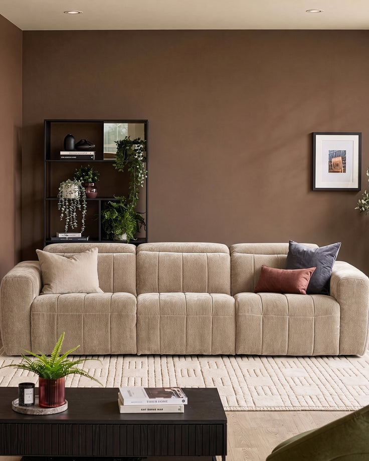 Skye 3-seater sofa in champagne fabric with quilted channeled design, displayed in a warm-toned living room setting.