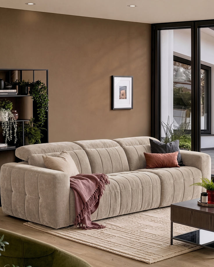 Skye 3-seater sofa in champagne fabric with vertical channel quilting, displayed in a modern living room setting.