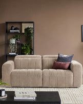 Champagne fabric 2-seater sofa with quilted detailing and rounded arms, styled in a living room setting.