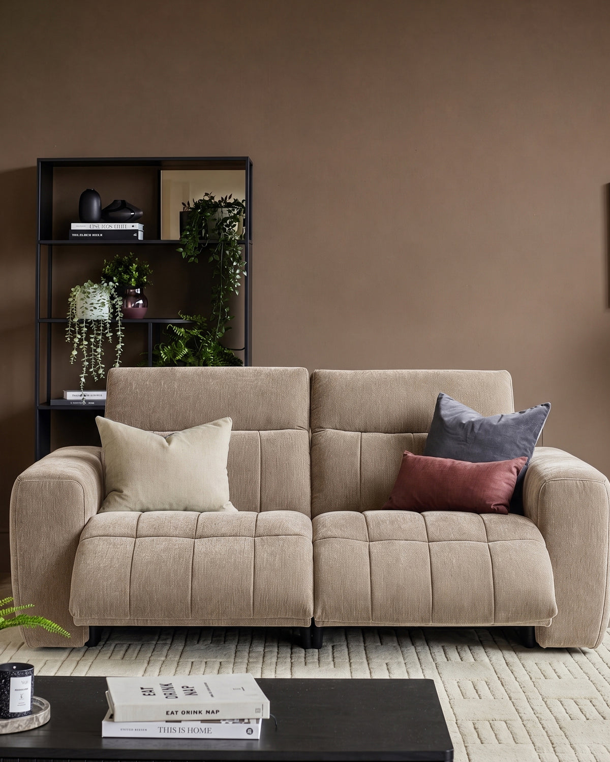 Champagne Skye 2-seater sofa with quilted seat cushions, rounded arms, and matching throw pillows in a styled living room setting.