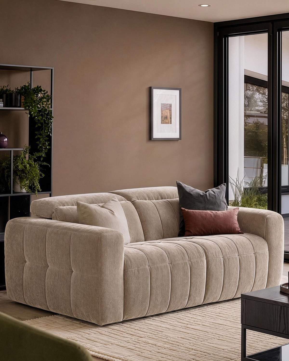 Skye 2-seater sofa in champagne fabric with quilted channel detailing, shown in a neutral living room setting with accent pillows.