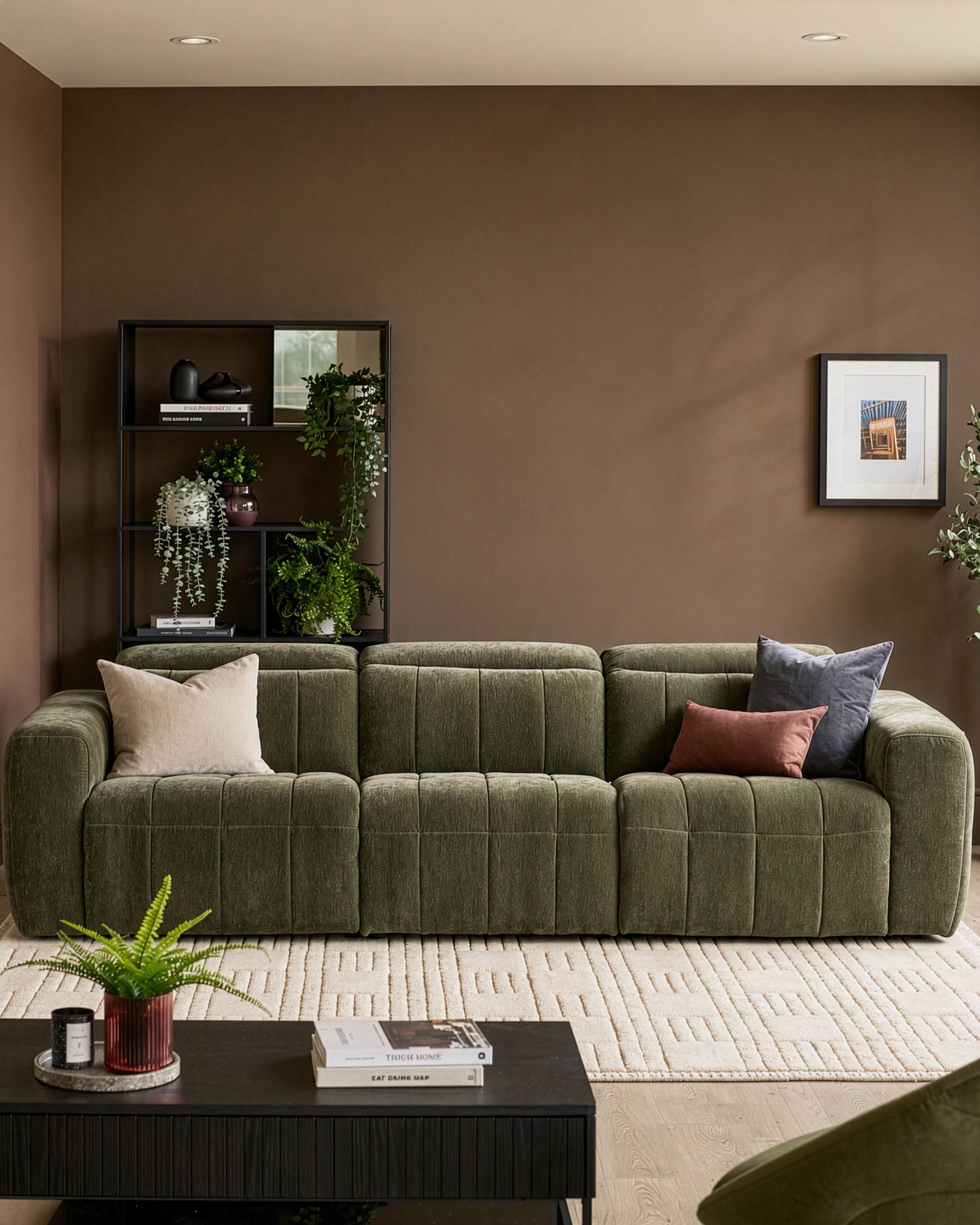 Skye 3-seater sofa in dark green fabric with quilted channel detailing and rounded arms, styled in a warm taupe living room.