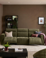 Skye 3-seater sofa in dark green fabric with quilted seat cushions, displayed in a styled living room setting.