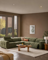Skye large corner sofa in dark green fabric with quilted detailing, displayed in a modern living room setting.