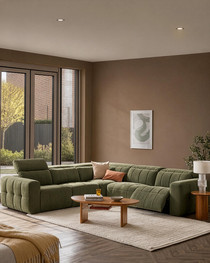Skye large corner sofa in dark green fabric with quilted detailing, displayed in a modern living room setting.