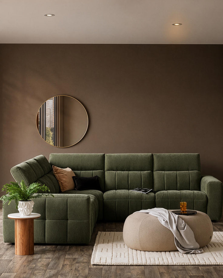 Skye small corner sofa in dark green fabric with quilted design, styled in a modern living room setting.