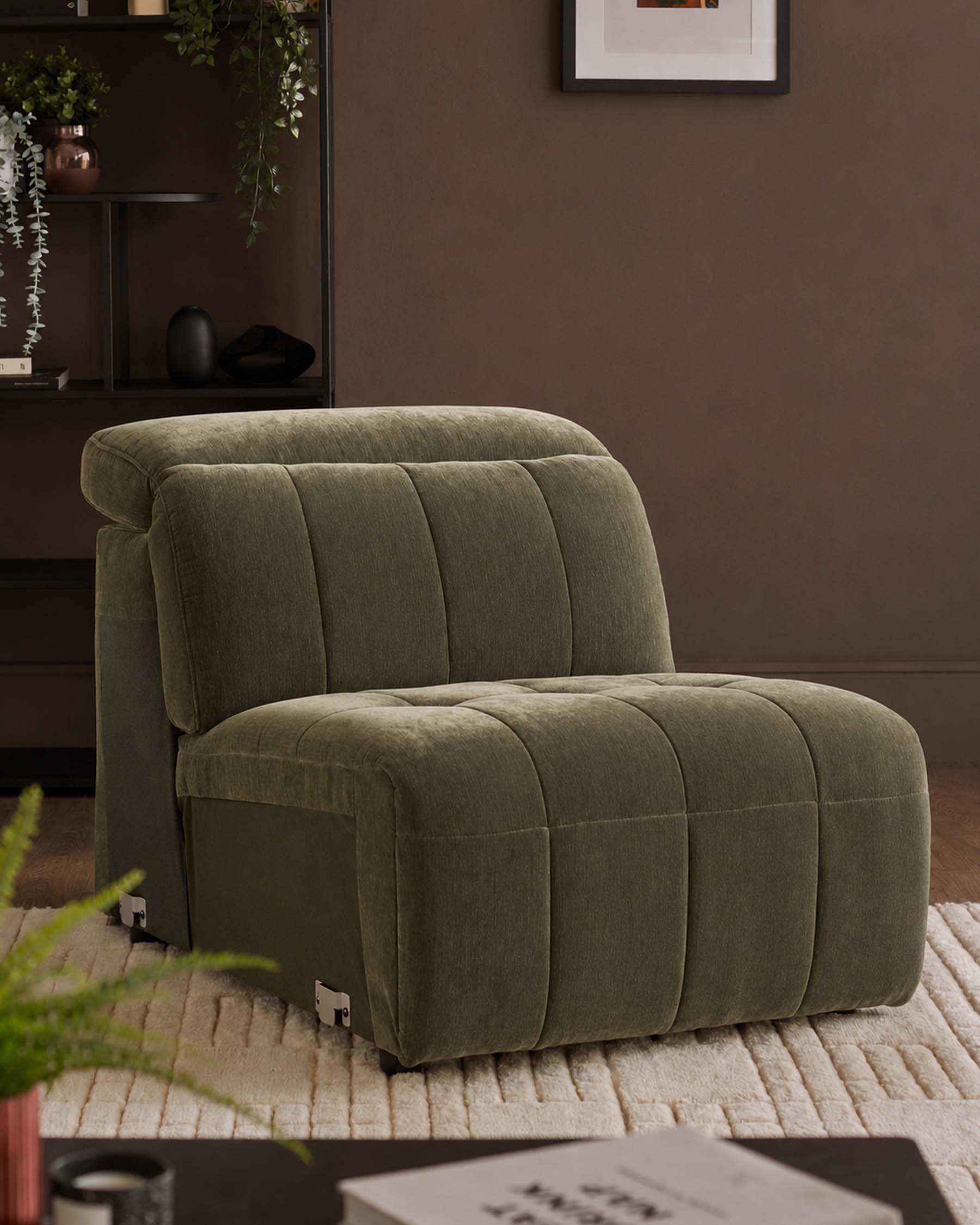 Skye single sofa module in dark green fabric with quilted channel detailing, rounded corners, and metal feet on a neutral rug.