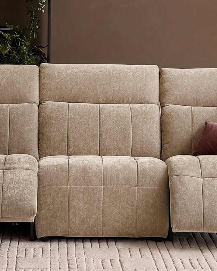 Champagne fabric single sofa module with quilted cushioning and clean lines, shown in close-up detail.