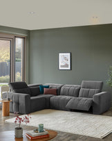 Modern grey sectional sofa with tufted design, accented by cushions, a round wooden side table, and a cream textured rug.